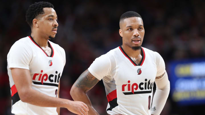 Apr 24, 2017; Portland, OR, USA; Portland Trail Blazers guard CJ McCollum (3) and guard Damian Lillard (0) talk during a break in the action against the Golden State Warriors in the second half of game four of the first round of the 2017 NBA Playoffs at Moda Center. Mandatory Credit: Jaime Valdez-USA TODAY Sports