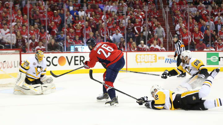 May 10, 2017; Washington, DC, USA; Washington Capitals right wing Daniel Winnik (26) attempts to shoot the puck past Pittsburgh Penguins goalie Marc-Andre Fleury (29) as Penguins defenseman Chad Ruhwedel (2) and Penguins defenseman Ian Cole (28) defend during the first period in game seven of the second round of the 2017 Stanley Cup Playoffs at Verizon Center. Mandatory Credit: Geoff Burke-USA TODAY Sports