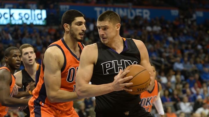 Nov 8, 2015; Oklahoma City, OK, USA; Phoenix Suns center Alex Len (21) drives to the basket against Oklahoma City Thunder center Enes Kanter (11) during the second quarter at Chesapeake Energy Arena. Mandatory Credit: Mark D. Smith-USA TODAY Sports