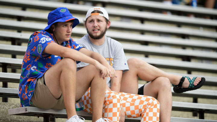 A Tennessee and Florida fan sit together during a game at Ben Hill Griffin Stadium in Gainesville, Fla. on Saturday, Sept. 25, 2021.Kns Tennessee Florida Football