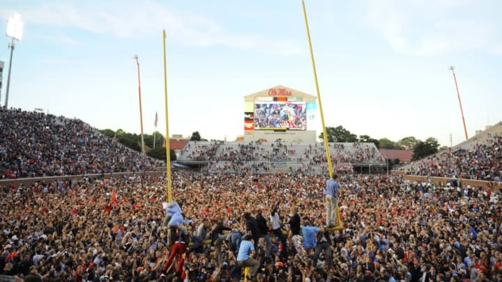 Oct 4, 2014; Oxford, MS, USA; Mississippi Rebels fans tear down the goal posts after a win against the Alabama Crimson Tide at Vaught-Hemingway Stadium. The Rebels won 23-17. Mandatory Credit: Christopher Hanewinckel-USA TODAY Sports