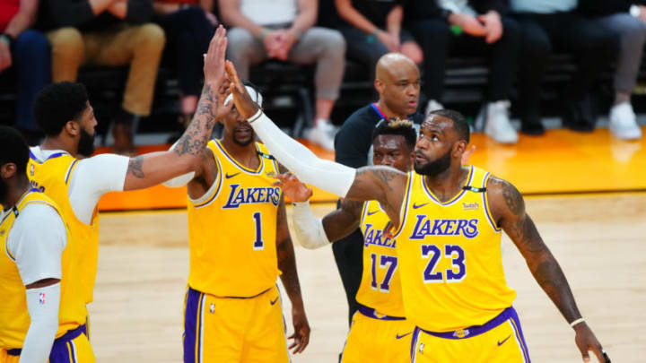 May 25, 2021; Phoenix, Arizona, USA; Los Angeles Lakers forward LeBron James (23) celebrates with teammates against the Phoenix Suns during the first half in game two of the first round of the 2021 NBA Playoffs at Phoenix Suns Arena. Mandatory Credit: Mark J. Rebilas-USA TODAY Sports