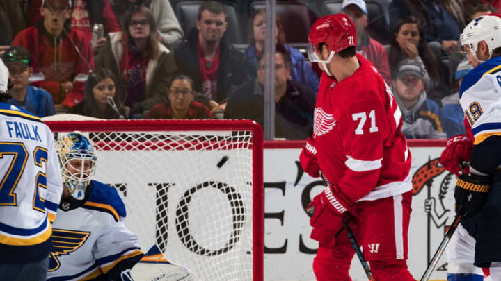 DETROIT, MI - OCTOBER 27: Filip Hronek #17 of the Detroit Red Wings (not pictured) scores a second period goal past goaltender Jordan Binnington #50 of the St. Louis Blues as Dylan Larkin #71 of the Wings looks for the rebound during an NHL game at Little Caesars Arena on October 27, 2019 in Detroit, Michigan. (Photo by Dave Reginek/NHLI via Getty Images)