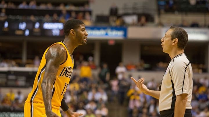 Mar 27, 2016; Indianapolis, IN, USA; Indiana Pacers forward Paul George (13) argues a call with a ref in the second half of the game against the Houston Rockets at Bankers Life Fieldhouse. The Indiana Pacers beat the Houston Rockets by the score of 104-101. Mandatory Credit: Trevor Ruszkowski-USA TODAY Sports