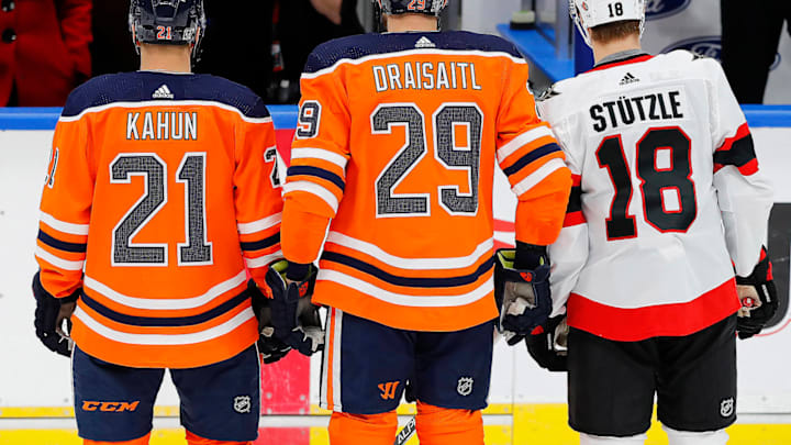 German players Edmonton Oilers forward Leon Draisaitl (29) and forward Dominik Kahun (21) and Ottawa Senators forward Tim Stuetzle (18) Mandatory Credit: Perry Nelson-USA TODAY Sports