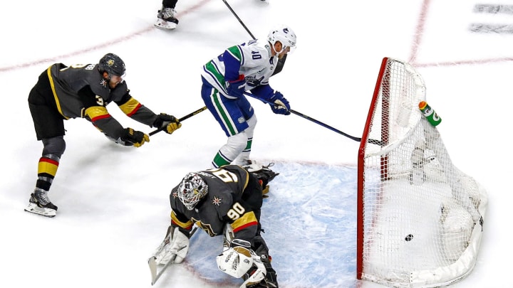 Elias Pettersson #40 of the Vancouver Canucks scores a goal past Robin Lehner #90 of the Vegas Golden Knights