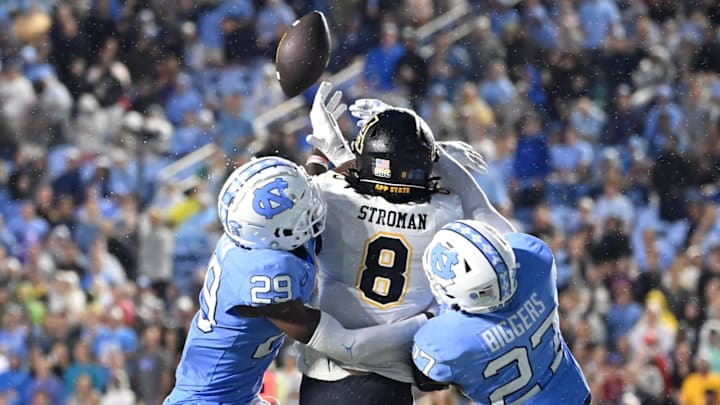 Sep 9, 2023; Chapel Hill, North Carolina, USA; North Carolina Tar Heels defensive backs Marcus Allen (29) and Giovanni Biggers (27) break up a pass intended for DUPLICATE***Appalachian State Mountaineers wide receiver Dalton Stroman (8) in the fourth quarter at Kenan Memorial Stadium. Mandatory Credit: Bob Donnan-USA TODAY Sports