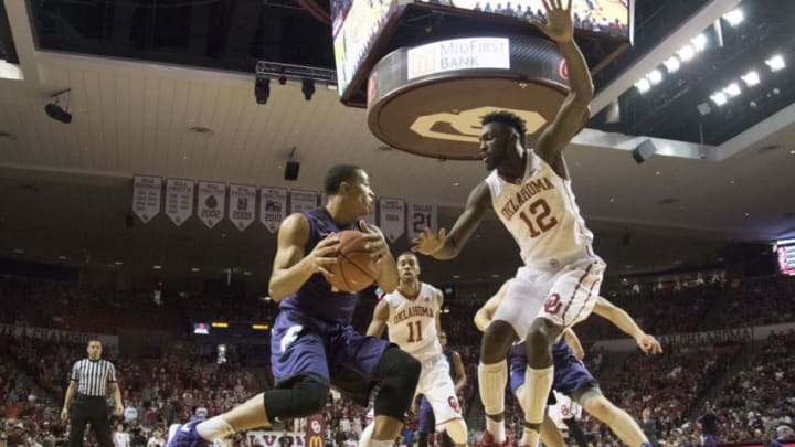 NORMAN, OK - JANUARY 9: Khadeem Lattin #12 of the Oklahoma Sooners blocks Justin Edwards #14 of the Kansas State Wildcats during the first half of a NCAA college basketball game at the Lloyd Noble Center on January 9, 2016 in Norman, Oklahoma. (Photo by J Pat Carter/Getty Images)