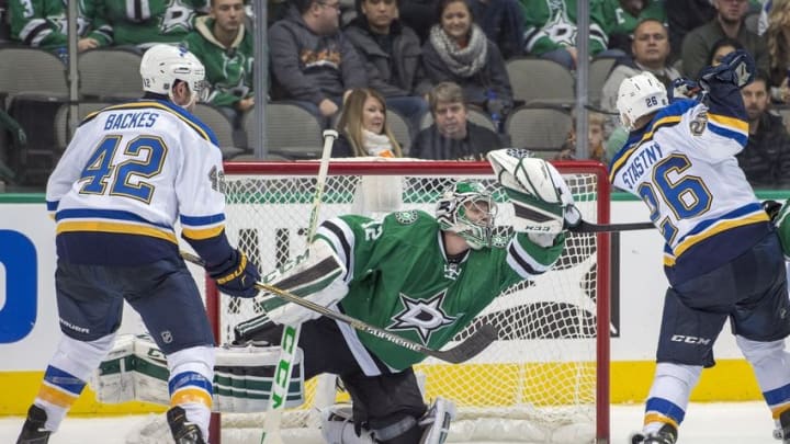 Dec 27, 2015; Dallas, TX, USA; Dallas Stars goalie Kari Lehtonen (32) grabs a puck in mid-air as St. Louis Blues center David Backes (42) and center Paul Stastny (26) look on during the third period at the American Airlines Center. The Stars shut out the Blues 3-0. Mandatory Credit: Jerome Miron-USA TODAY Sports