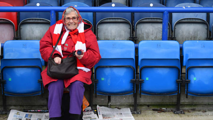 HUDDERSFIELD, ENGLAND - FEBRUARY 09: An Arsenal fan takes her seat before the Premier League match between Huddersfield Town and Arsenal FC at John Smith's Stadium on February 09, 2019 in Huddersfield, United Kingdom. (Photo by Michael Regan/Getty Images)