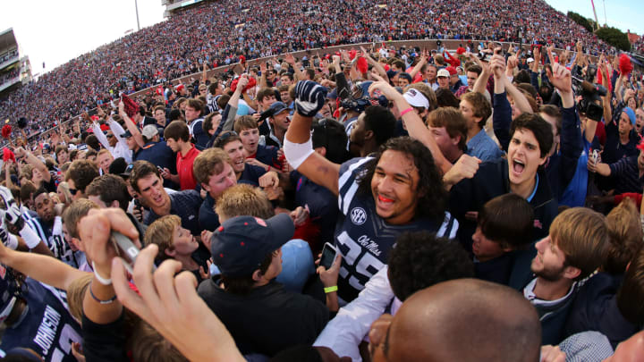 OXFORD, MS – OCTOBER 4: Fans of the Ole Miss Rebels rush the field to celebrate the victory over the Alabama Crimson Tide on OCTOBER 4, 2014 at Vaught-Hemingway Stadium in Oxford, Mississippi. Mississippi beat Alabama 23-17. (Photo by Joe Murphy/Getty Images)