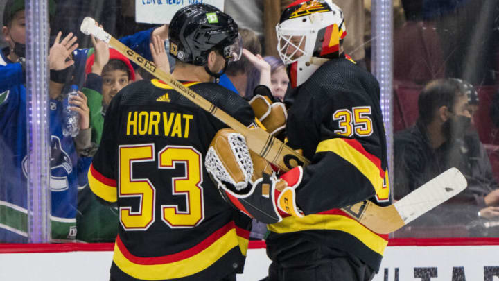 Feb 24, 2022; Vancouver, British Columbia, CAN; Vancouver Canucks forward Bo Horvat (53) and goalie Thatcher Demko (35) celebrate their victory against the Calgary Flames at Rogers Arena. Canucks won 7-1. Mandatory Credit: Bob Frid-USA TODAY Sports