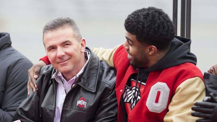 Jan 24, 2015; Columbus, OH, USA; Ohio State Buckeyes running back Ezekiel Elliott (15) hugs head coach Urban Meyer during the National Championship celebration at Ohio Stadium. Mandatory Credit: Greg Bartram-USA TODAY Sports