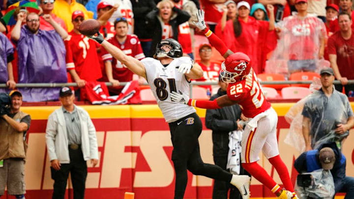 KANSAS CITY, MO - SEPTEMBER 22: Hayden Hurst #81 of the Baltimore Ravens reaches for a pass in the end zone with pressure form Juan Thornhill #22 of the Kansas City Chiefs at Arrowhead Stadium on September 22, 2019 in Kansas City, Missouri. (Photo by David Eulitt/Getty Images)