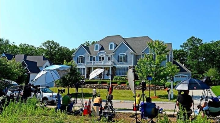 June 21 2013; North Attleborough, MA, USA; Media members stake out in front of the house of New England Patriots tight end Aaron Hernandez. Mandatory Credit: Andrew Weber-USA TODAY Sports