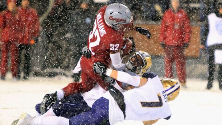 PULLMAN, WA - NOVEMBER 23: James Williams #32 of the Washington State Cougars carries the ball against the Washington Huskies in the second half at Martin Stadium during the 111th Apple Cup on November 23, 2018 in Pullman, Washington. Washington defeated Washington State 28-15. (Photo by William Mancebo/Getty Images)