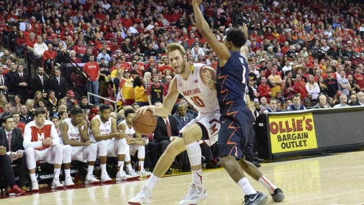 Mar 3, 2016; College Park, MD, USA; Maryland Terrapins forward Jake Layman (10) makes a move to the basket as Illinois Fighting Illini guard Jaylon Tate (1) defends during the second half at Xfinity Center. Maryland Terrapins defeated Illinois Fighting Illini 81-55. Mandatory Credit: Tommy Gilligan-USA TODAY Sports