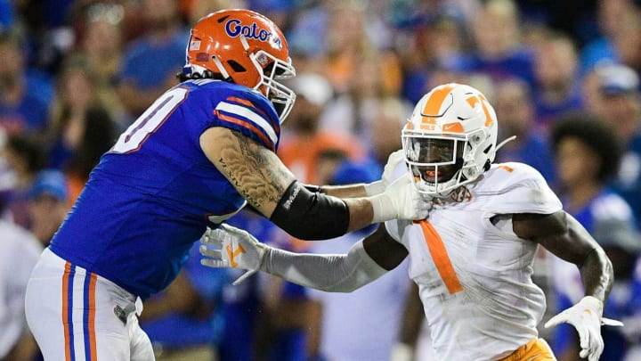 Tennessee defensive back Trevon Flowers (1) is blocked by a Florida defender during a game at Ben Hill Griffin Stadium in Gainesville, Fla. on Saturday, Sept. 25, 2021.Kns Tennessee Florida Football