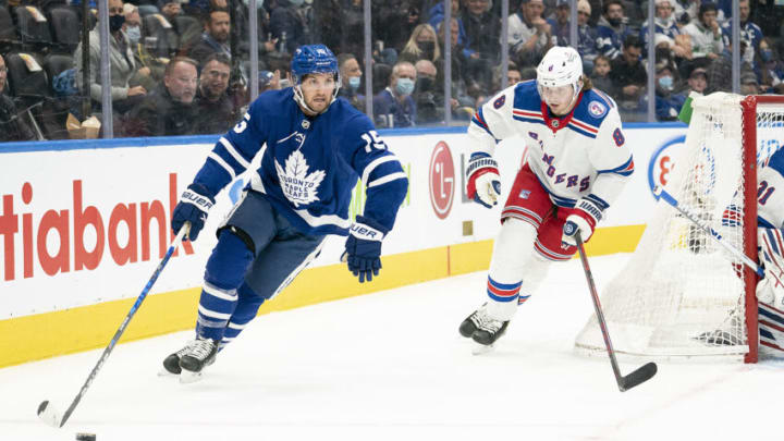 Nov 18, 2021; Toronto, Ontario, CAN; Toronto Maple Leafs center Alexander Kerfoot (15) skates with the puck as New York Rangers defenseman Jacob Trouba (8) gives chase during the first period at Scotiabank Arena. Mandatory Credit: Nick Turchiaro-USA TODAY Sports