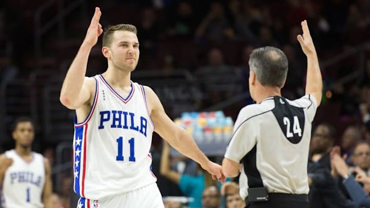 Feb 10, 2016; Philadelphia, PA, USA; Philadelphia 76ers guard Nik Stauskas (11) reacts to his last second three pointer in front of referee Mike Callahan (24) at the end of the second quarter against the Sacramento Kings at Wells Fargo Center. Mandatory Credit: Bill Streicher-USA TODAY Sports