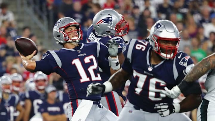 FOXBOROUGH, MA - AUGUST 16: Tom Brady #12 of the New England Patriots throws a pass in the first half against the Philadelphia Eagles as Isaiah Wynn #76 blocks during the preseason game at Gillette Stadium on August 16, 2018 in Foxborough, Massachusetts. (Photo by Tim Bradbury/Getty Images)