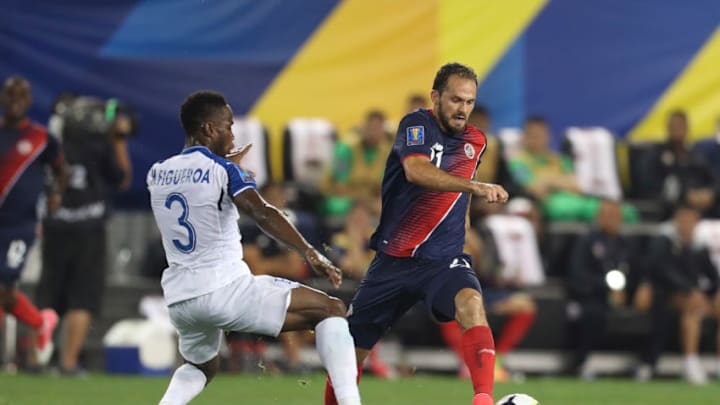 HARRISON, NJ - JULY 07: Marco Ureña of Costa Rica fights for the ball with Maynor Figueroa of Honduras during the Group A match between Honduras and Costa Rica as part of the Gold Cup 2017 at Red Bull Arena on July 07, 2017 in Harrison, New Jersey. (Photo by Omar Vega/LatinContent/Getty Images)