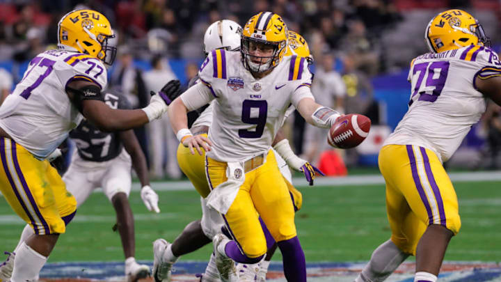 GLENDALE, AZ - JANUARY 01: LSU Tigers quarterback Joe Burrow (9) hands the ball off during the college football game between the UCF Knights and the LSU Tigers on January 1, 2019 at State Farm Stadium in Glendale, Arizona. (Photo by Kevin Abele/Icon Sportswire via Getty Images)