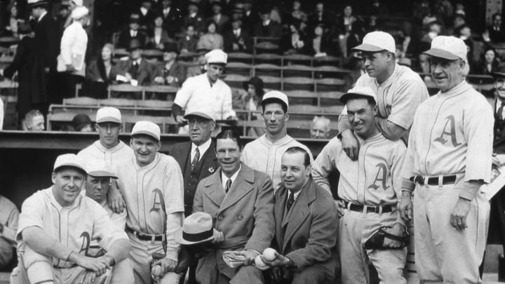 PHILADELPHIA – OCTOBER 1, 1930. A group of American League Champion and soon to be World Champion Philadelphia Athletics pose for a dugout photo before game one of the World Series in the Baker Bowl in Philadelphia in October of 1930. Lefty Grove is standing tall at the back, and Jimmy Foxx is leaning on Mule Haas’ shoulders. (Photo by Mark Rucker/Transcendental Graphics, Getty Images)