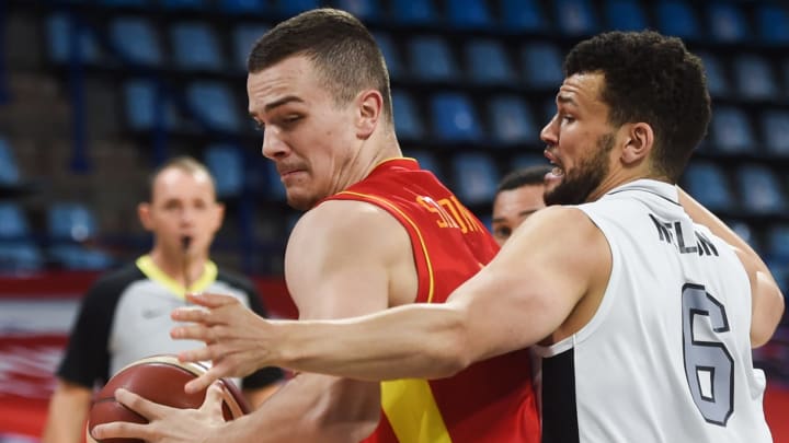 Montenegro’s Marko Simonovic (L) fights for the ball with Great Britain’s Luke Nelson during the Eurobasket 2020 basketball match between Montenegro and Great Britain in Pau, southwestern France, on November 29, 2020. (Photo by GAIZKA IROZ / AFP) (Photo by GAIZKA IROZ/AFP via Getty Images)