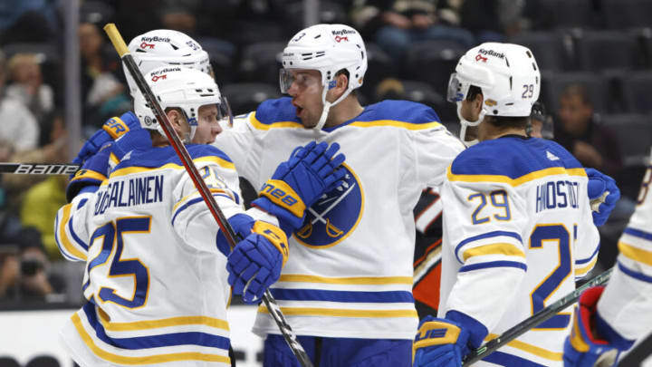 ANAHEIM, CALIFORNIA - OCTOBER 28: Vinnie Hinostroza #29, Mark Pysyk #13, Anders Bjork #96 of the Buffalo Sabres congratulate Arttu Ruotsalainen #25 of the Buffalo Sabres after he scored a goal during the second period of a game against the Anaheim Ducks at Honda Center on October 28, 2021 in Anaheim, California. (Photo by Sean M. Haffey/Getty Images)