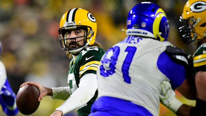 GREEN BAY, WISCONSIN - NOVEMBER 28: Aaron Rodgers #12 of the Green Bay Packers looks to pass the ball against the Los Angeles Rams in the second half at Lambeau Field on November 28, 2021 in Green Bay, Wisconsin. (Photo by Patrick McDermott/Getty Images)
