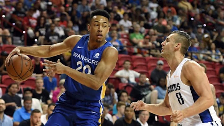 LAS VEGAS, NV - JULY 09: Elijah Brown #20 of the Golden State Warriors passes against Kyle Collinsworth #8 of the Dallas Mavericks during the 2018 NBA Summer League at the Thomas & Mack Center on July 9, 2018 in Las Vegas, Nevada. The Mavericks defeated the Warriors 91-71. NOTE TO USER: User expressly acknowledges and agrees that, by downloading and or using this photograph, User is consenting to the terms and conditions of the Getty Images License Agreement. (Photo by Ethan Miller/Getty Images)