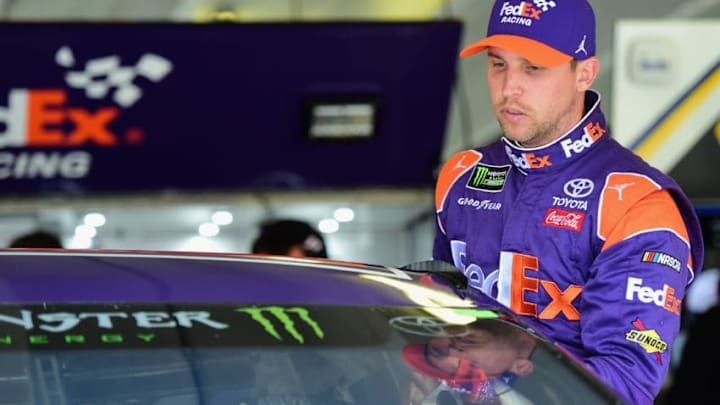 HAMPTON, GA - FEBRUARY 23: Denny Hamlin, driver of the #11 FedEx Ground Toyota, climbs into his car during practice for the Monster Energy NASCAR Cup Series Folds of Honor QuikTrip 500 at Atlanta Motor Speedway on February 23, 2018 in Hampton, Georgia. (Photo by Jared C. Tilton/Getty Images)