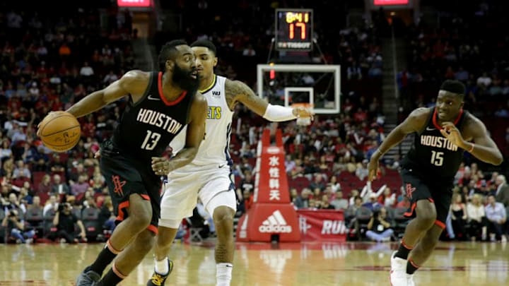 HOUSTON, TX - FEBRUARY 09: James Harden #13 of the Houston Rockets drives to the basket defended by Gary Harris #14 of the Denver Nuggets in the first half at Toyota Center on February 9, 2018 in Houston, Texas. NOTE TO USER: User expressly acknowledges and agrees that, by downloading and or using this Photograph, user is consenting to the terms and conditions of the Getty Images License Agreement. (Photo by Tim Warner/Getty Images)