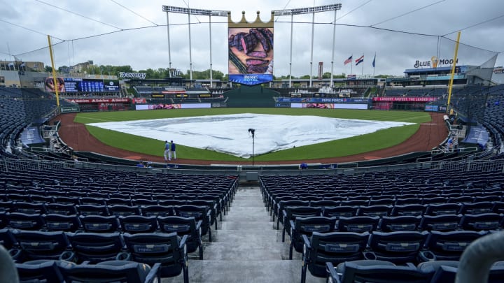 KANSAS CITY, MO - MAY 22: The tarp drapes the field as rain comes down before the start of the Detroit Tigers and the Kansas City Royals game at Kauffman Stadium on May 22, 2021 in Kansas City, Missouri. (Photo by Kyle Rivas/Getty Images)