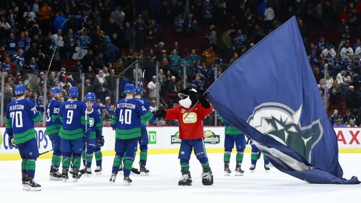 VANCOUVER, BC – JANUARY 18: Fin congratulates Elias Pettersson #40 of the Vancouver Canucks after winning their NHL game against the San Jose Sharks at Rogers Arena January 18, 2020 in Vancouver, British Columbia, Canada. Vancouver won 4-1. (Photo by Jeff Vinnick/NHLI via Getty Images)