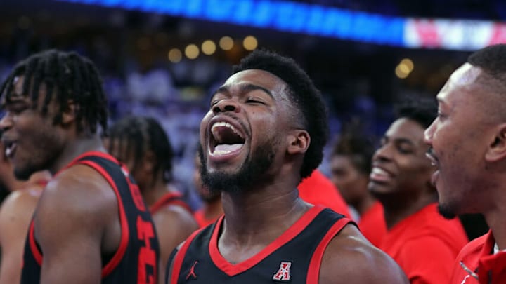 MEMPHIS, TENNESSEE - MARCH 05: Jamal Shead #1 of the Houston Cougars celebrates after scoring the game winning point after the game against the Memphis Tigers at FedExForum on March 05, 2023 in Memphis, Tennessee. (Photo by Justin Ford/Getty Images)