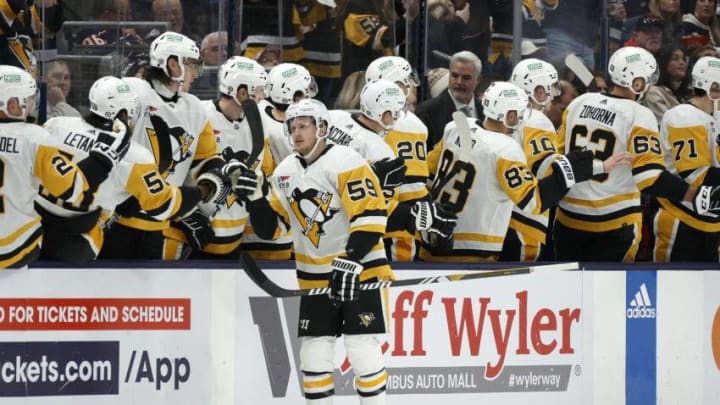 COLUMBUS, OHIO - NOVEMBER 14: Jake Guentzel #59 of the Pittsburgh Penguins is congratulated by his teammates after scoring a goal during the second period of the game against the Columbus Blue Jackets at Nationwide Arena on November 14, 2023 in Columbus, Ohio. (Photo by Kirk Irwin/Getty Images)