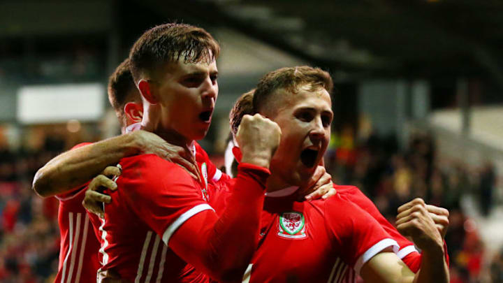 WREXHAM, WALES - MARCH 20: Ben Woodburn of Wales celebrates with team mates after scoring his team's first goal during the International Friendly match between Wales and Trinidad and Tobago at Racecourse Ground on March 20, 2019 in Wrexham, Wales. (Photo by Alex Livesey/Getty Images)