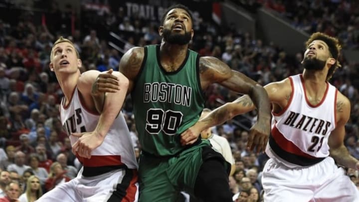 Mar 31, 2016; Portland, OR, USA; Portland Trail Blazers center Mason Plumlee (24), Boston Celtics forward Amir Johnson (90) and Trail Blazers guard Allen Crabbe (23) battle for position during the fourth quarter at the Moda Center at the Rose Quarter. The Trail Blazers won 116-109. Mandatory Credit: Steve Dykes-USA TODAY Sports