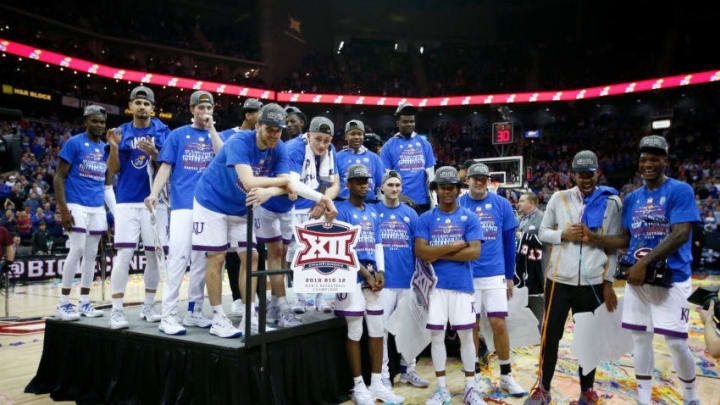 KANSAS CITY, MO - MARCH 10: The Kansas Jayhawks watch a highlight video after the Jayhawks defeated the West Virginia Mountaineers 81-70 to win the Big 12 Basketball Tournament Championship game at Sprint Center on March 10, 2018 in Kansas City, Missouri. (Photo by Jamie Squire/Getty Images)