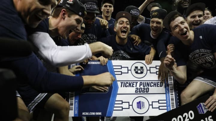 LAS VEGAS, NEVADA - MARCH 07: The Utah State Aggies celebrate after defeating the San Diego State Aztecs to win the championship game of the Mountain West Conference basketball tournament at the Thomas & Mack Center on March 7, 2020 in Las Vegas, Nevada. The Aggies defeated the Aztecs 59-56. (Photo by Joe Buglewicz/Getty Images)