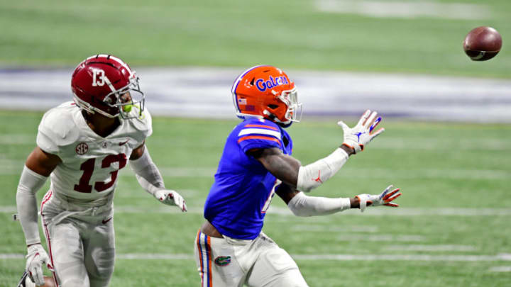 Dec 19, 2020; Atlanta, Georgia, USA; Florida Gators wide receiver Kadarius Toney (1) makes a catch against Alabama Crimson Tide defensive back Malachi Moore (13) in the SEC Championship at Mercedes-Benz Stadium. Mandatory Credit: Adam Hagy-USA TODAY Sports