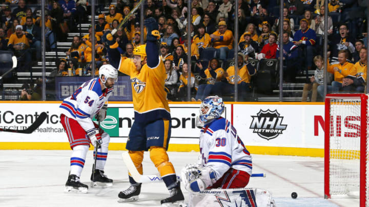 NASHVILLE, TENNESSEE - DECEMBER 29: Nick Bonino #13 of the Nashville Predators celebrates after scoring a goal against goalie Henrik Lundqvist #30 of the New York Rangers during the first period at Bridgestone Arena on December 29, 2018 in Nashville, Tennessee. (Photo by Frederick Breedon/Getty Images)