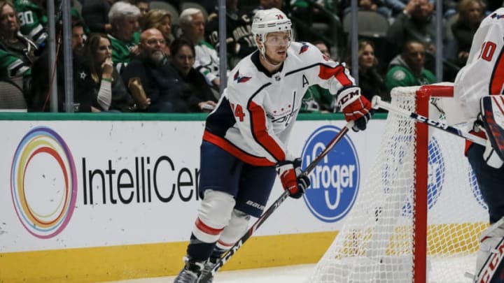DALLAS, TX - OCTOBER 12: Washington Capitals defenseman John Carlson (74) looks to pass the puck during the game between the Dallas Stars and the Washington Capitals on October 12, 2019 at the American Airlines Center in Dallas, Texas. (Photo by Matthew Pearce/Icon Sportswire via Getty Images)