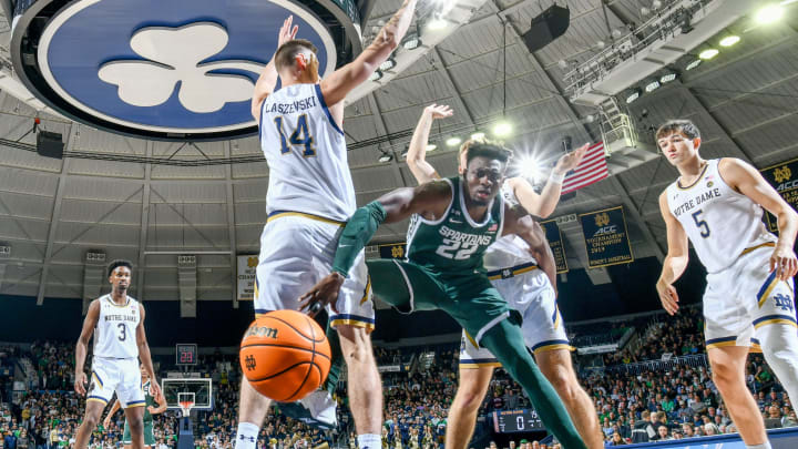 Nov 30, 2022; South Bend, Indiana, USA; Michigan State Spartans center Mady Sissoko (22) loses the ball as Notre Dame Fighting Irish forward Nate Laszewski (14) and guard Dane Goodwin (23) defend in the first half at the Purcell Pavilion. Mandatory Credit: Matt Cashore-USA TODAY Sports