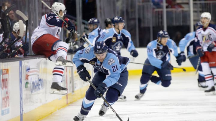 CLEVELAND, OH - DECEMBER 02: Milwaukee Admirals LW Harry Zolnierczyk (21) controls the puck during the first period of the AHL hockey game between the Milwaukee Admirals and Cleveland Monsters on December 02, 2016, at Quicken Loans Arena in Cleveland, OH. Cleveland defeated Milwaukee 4-1. (Photo by Frank Jansky/Icon Sportswire via Getty Images)