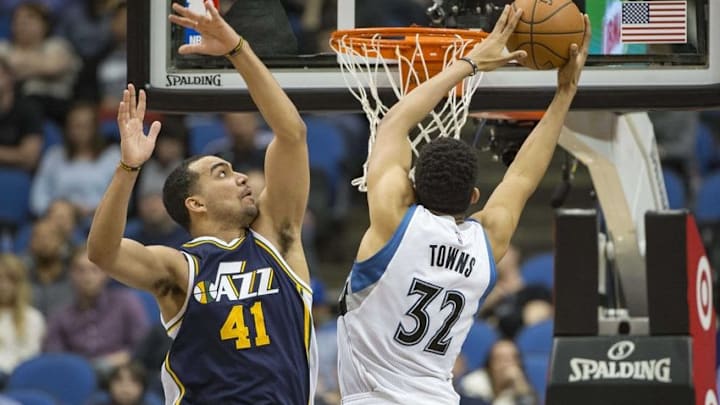 Mar 26, 2016; Minneapolis, MN, USA; Minnesota Timberwolves center Karl-Anthony Towns (32) goes up for a layup past Utah Jazz forward Trey Lyles (41) in the second half at Target Center. the Jazz won 93-84. Mandatory Credit: Jesse Johnson-USA TODAY Sports