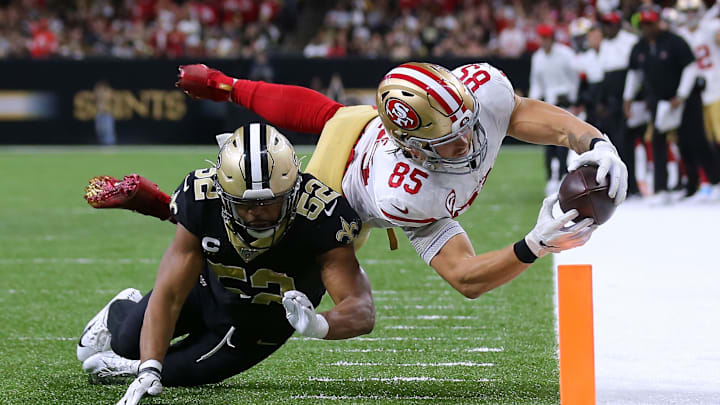 NEW ORLEANS, LOUISIANA – DECEMBER 08: George Kittle #85 of the San Francisco 49ers scores a touchdown as Craig Robertson #52 of the New Orleans Saints defends during the second half of a game at the Mercedes Benz Superdome on December 08, 2019 in New Orleans, Louisiana. (Photo by Jonathan Bachman/Getty Images)