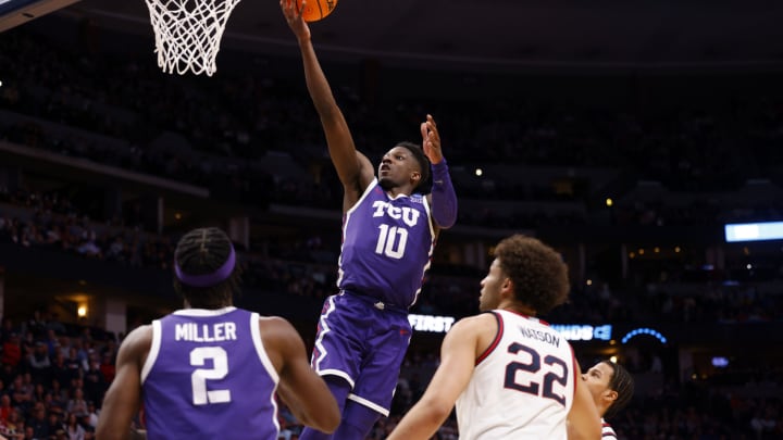 Mar 19, 2023; Denver, CO, USA; TCU Horned Frogs guard Damion Baugh (10) shoots against Gonzaga Bulldogs forward Anton Watson (22) in the second half at Ball Arena. Mandatory Credit: Michael Ciaglo-USA TODAY Sports